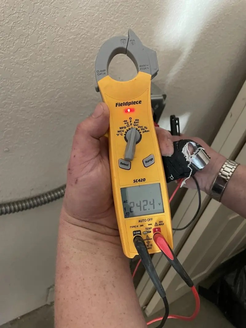 Voltage testing with clamp meter during Outlet Installation in Jacksonville
